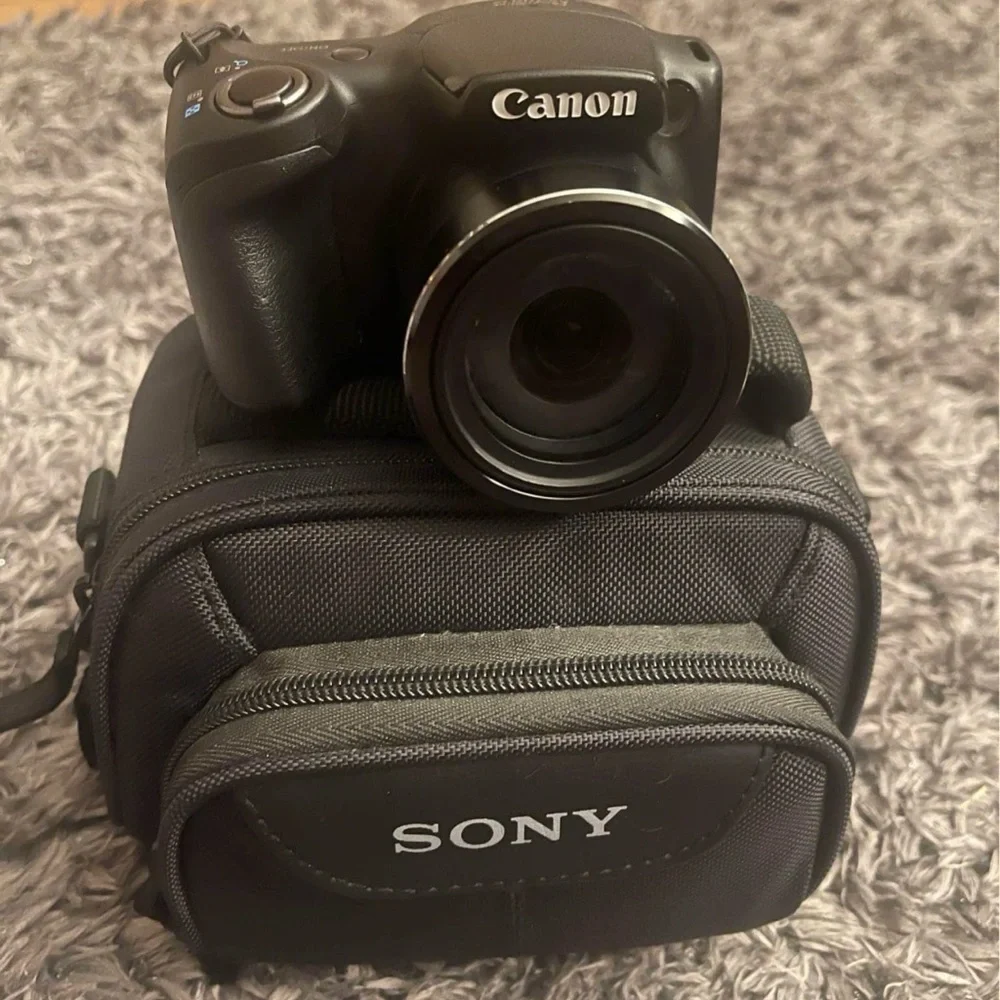 Canon Black Digital Camera with Sony Case